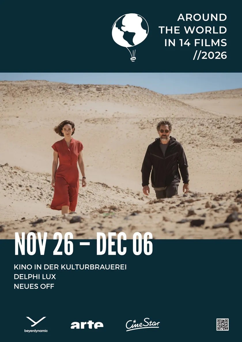 Festival poster 2026 — a woman in a red dress and a man walking through a desert landscape, below “Nov 26 – Dec 06”